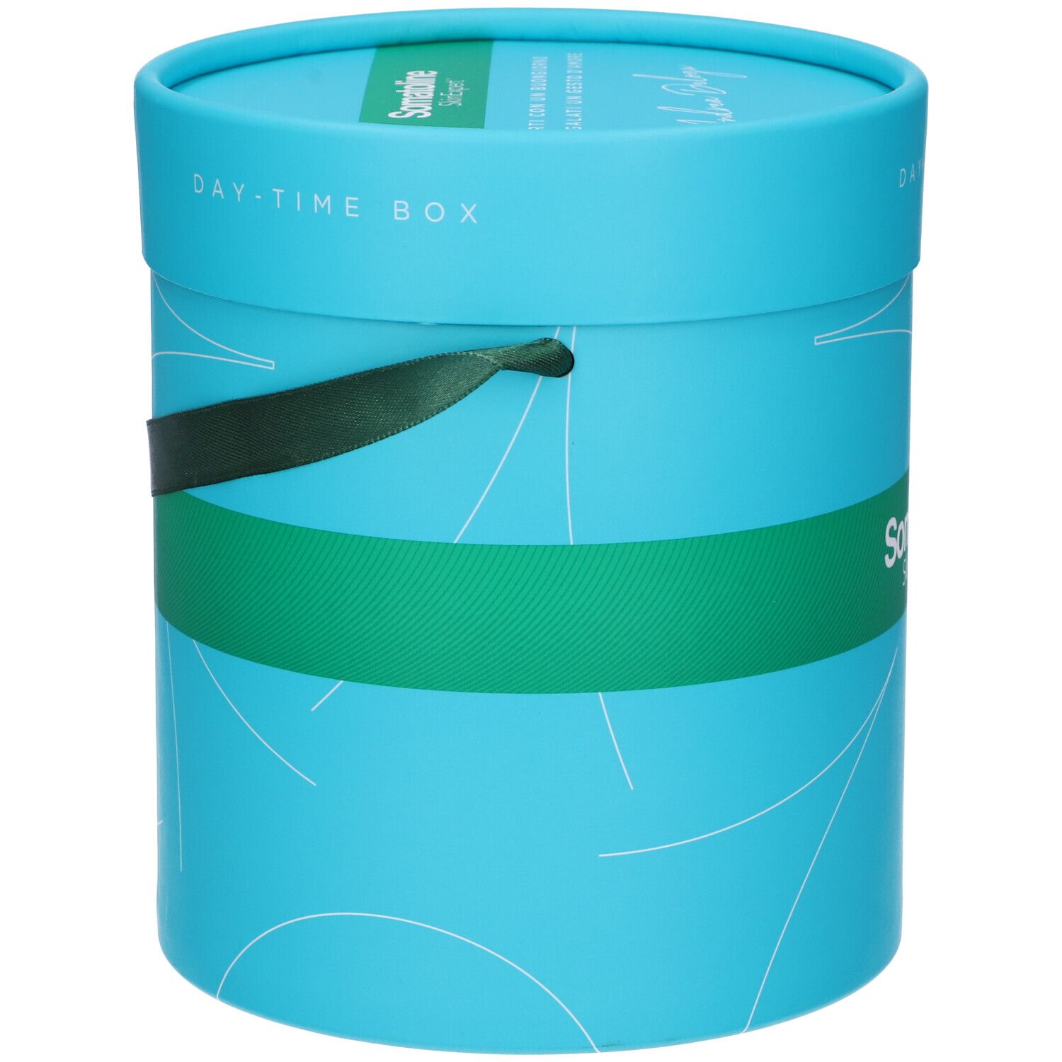 Scatola cilindrica turchese con fascia verde. Scritta "Somatoline SkinExpert". Coperchio con "Day-Time Box". Fiocco verde.