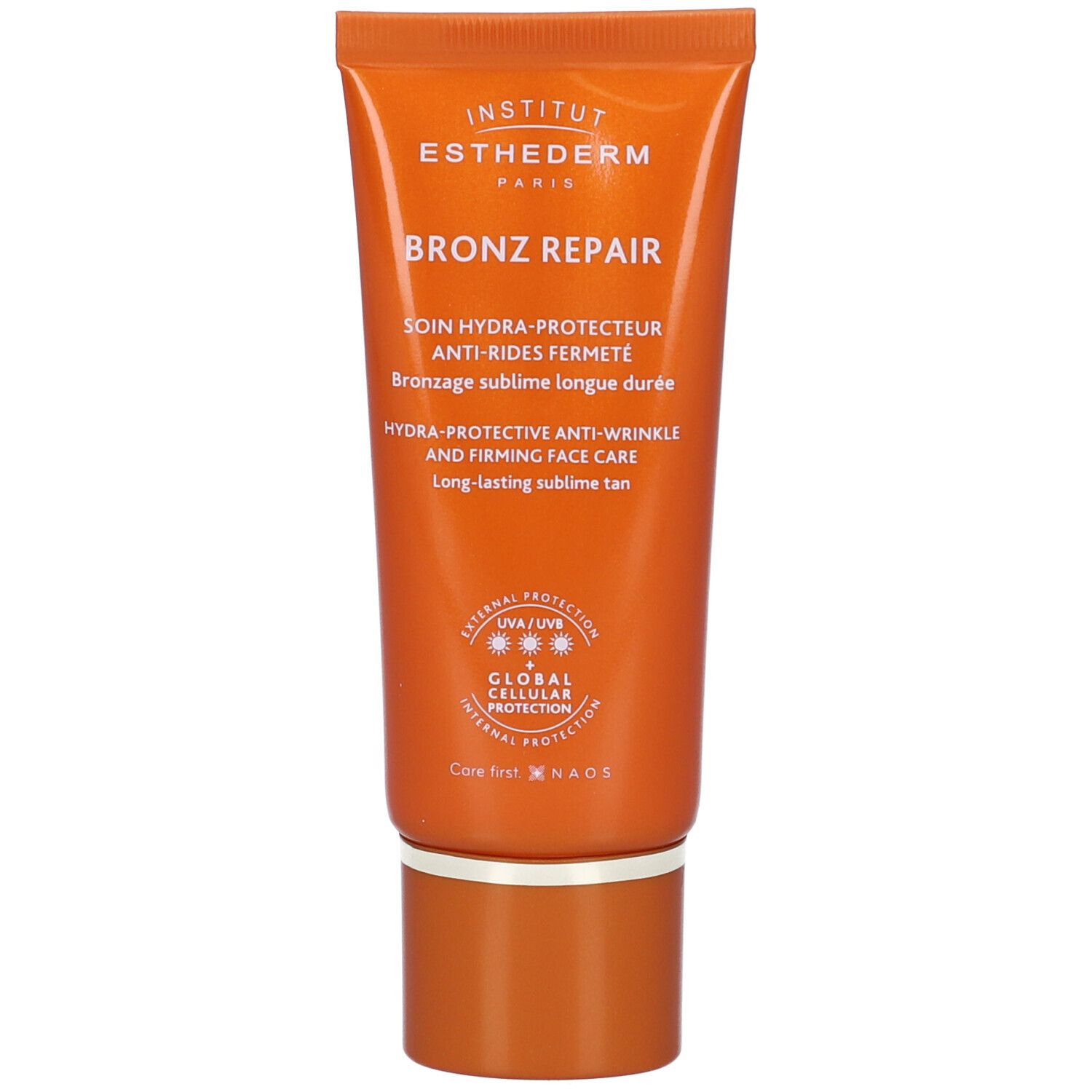 Orange Tube mit Aufschrift: Institut Esthederm, Bronz Repair. Sonnenschutzmittel für das Gesicht. Mit Schraubverschluss.