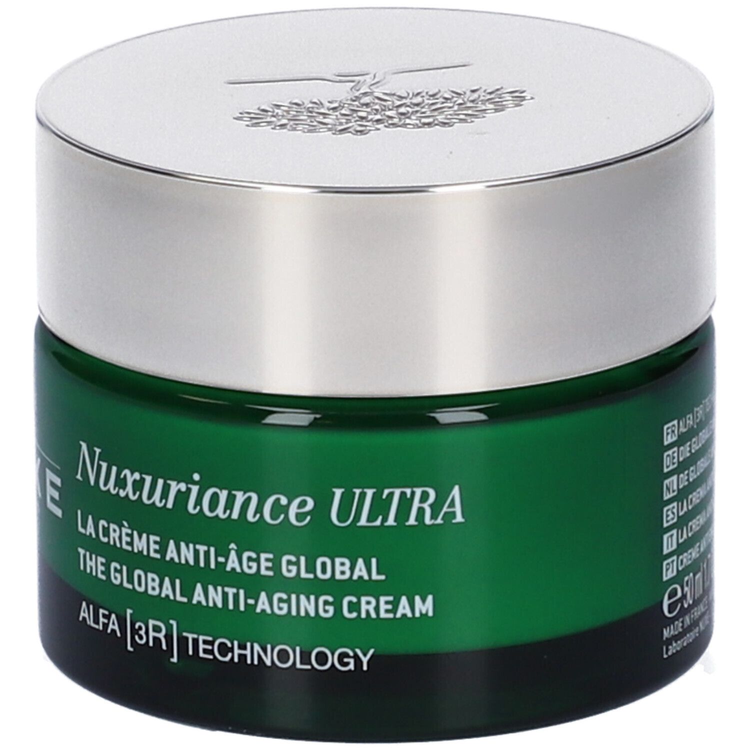 Vaso di crema verde con coperchio argentato. Scritta: Nuxuriance Ultra, La Crème Anti-Âge Global, Alfa [3R] Tecnologia.