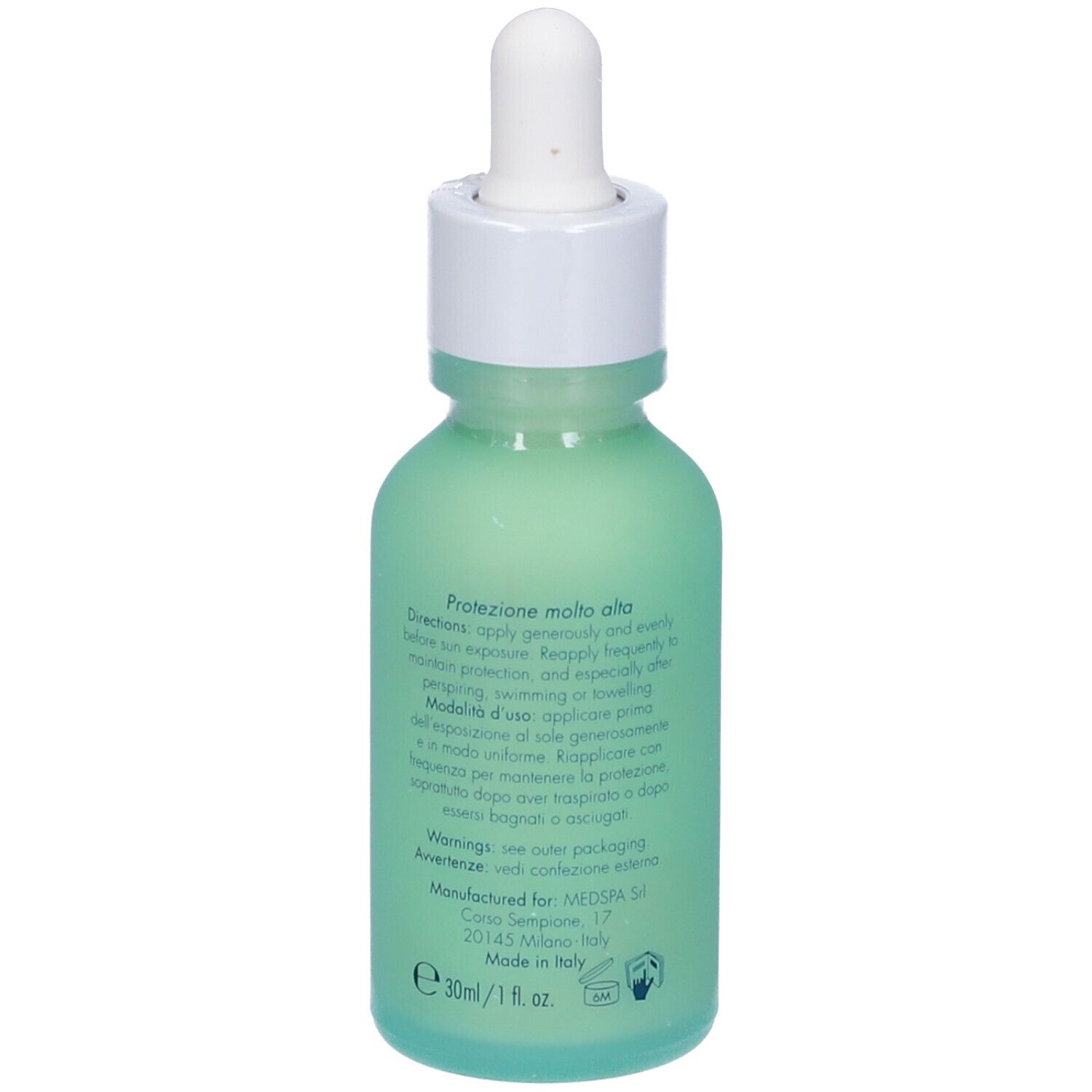 Vista posteriore di un flacone verde con tappo bianco e contagocce. Testo sul flacone.
