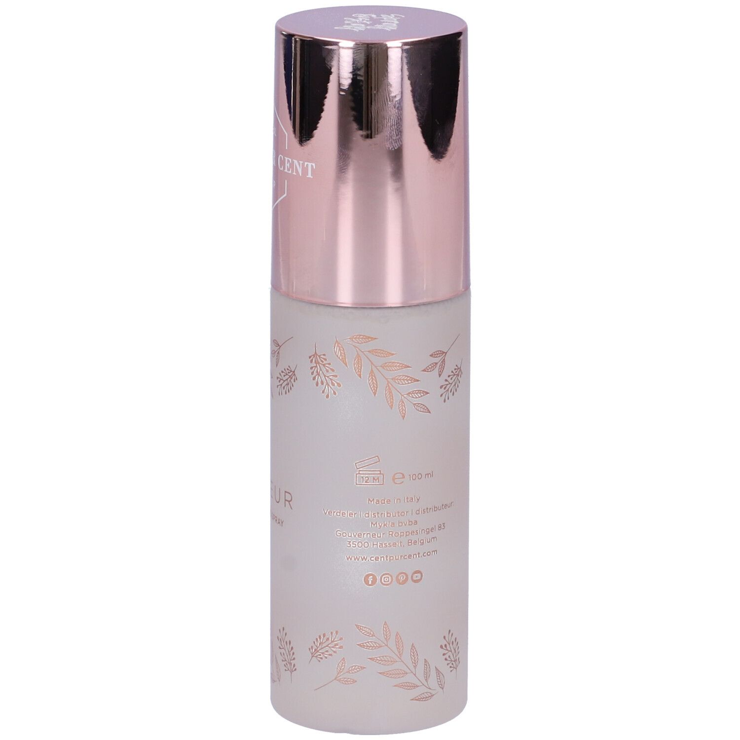 Spray fissante con tappo color oro rosa. Scritta: Cent Pur Cent, Le Fixeur. Flacone bianco opaco con motivo floreale.