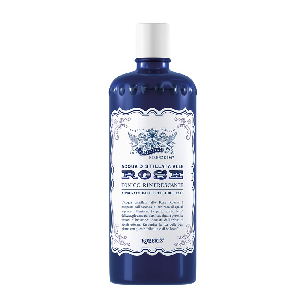 Dunkelblaue Flasche mit weißem Etikett und weißem Verschluss. Enthält Rosenwasser-Toner.