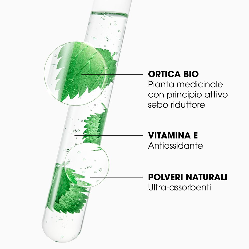 Reagenzglas mit Brennnesselextrakt, Vitamin E und natürlichen Pulvern.