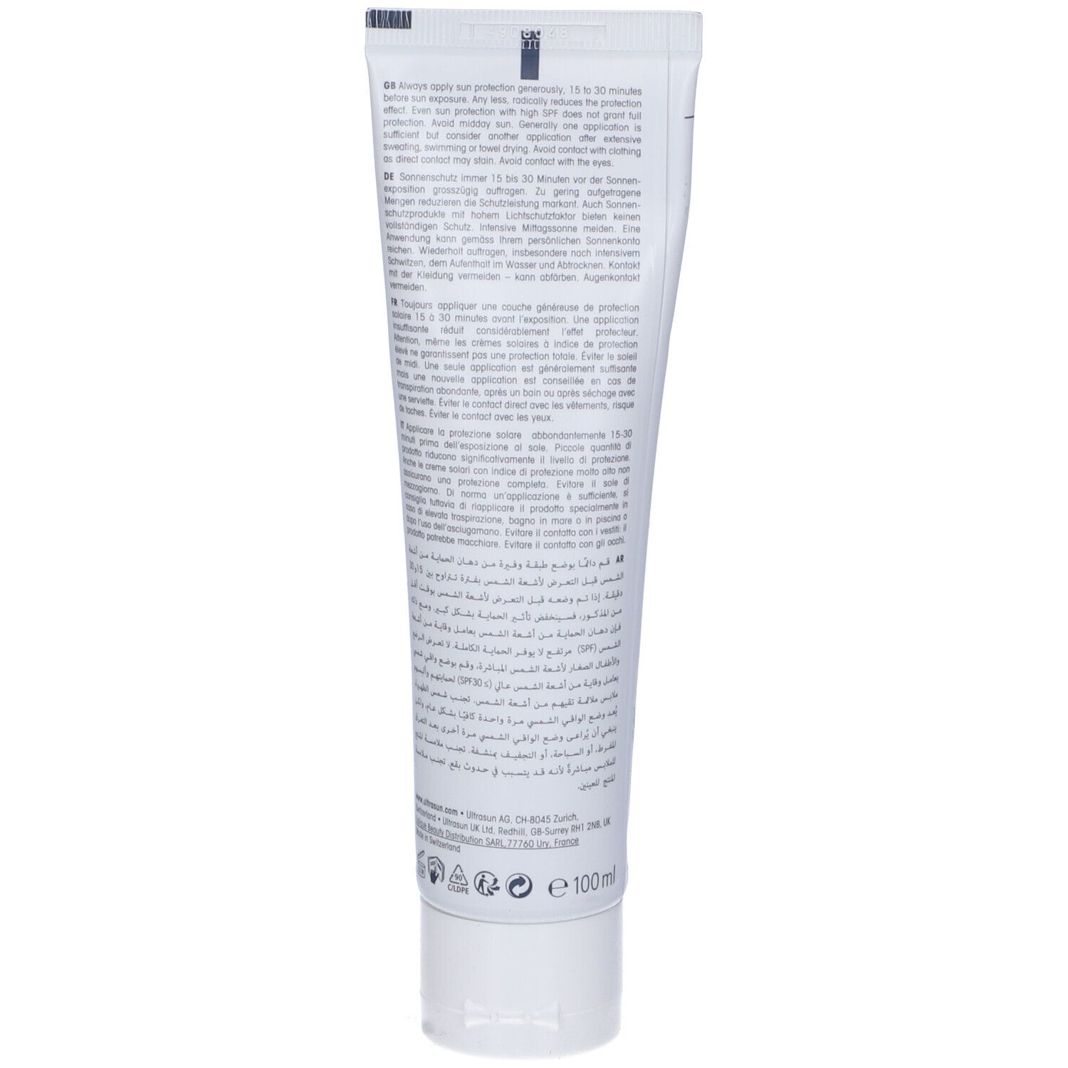 Retro di un tubo di crema solare bianca. Testo in più lingue. Con istruzioni per l'uso.