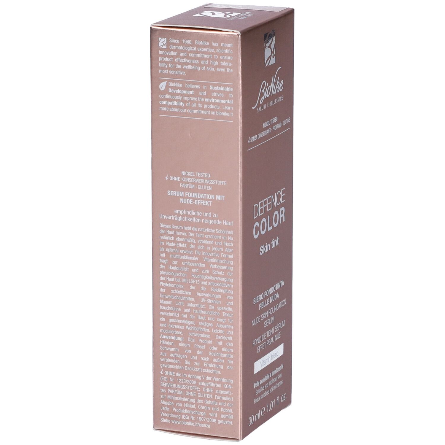Confezione rosa, vista laterale. Testo: Bionike, Defence Color Skin Tint. Dettagli ingredienti e certificazioni.