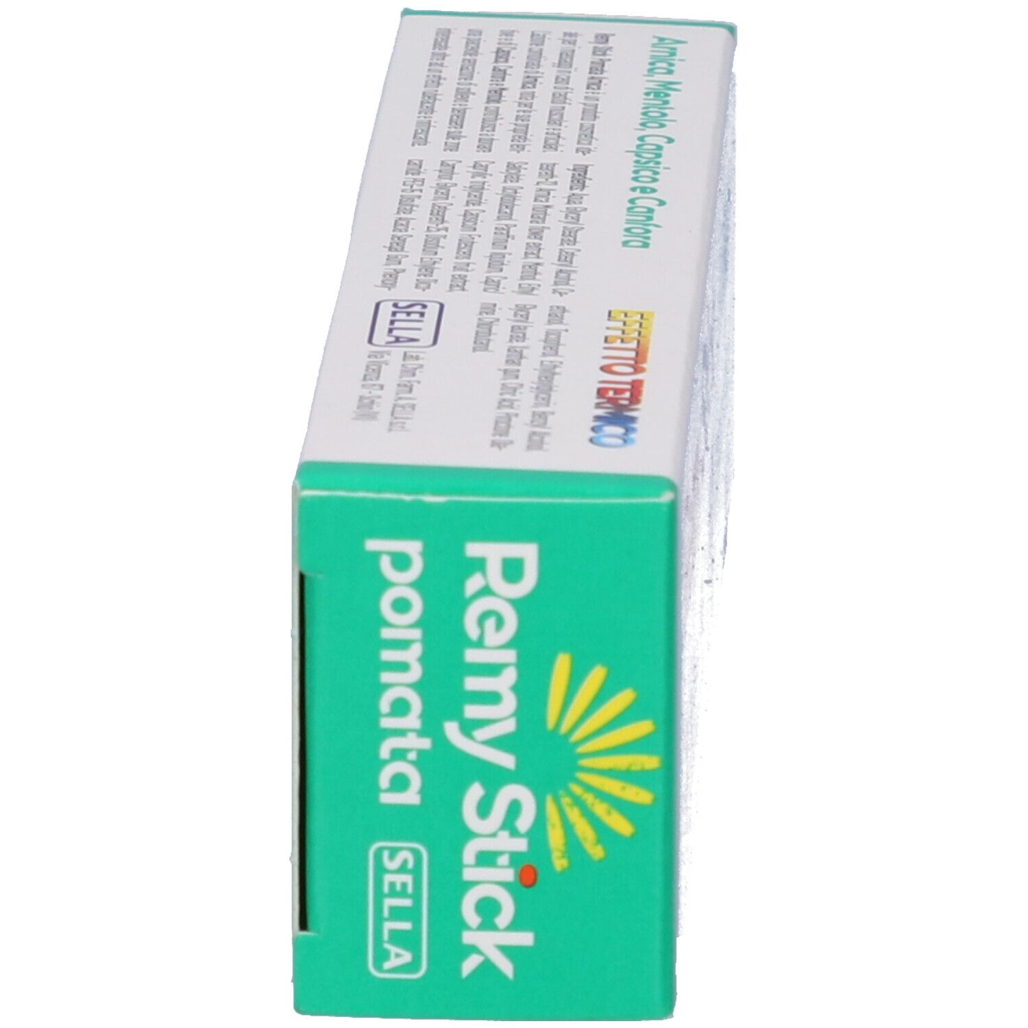 Seitenansicht der Schachtel. Aufschrift: Remy Stick, Arnica Pomata. Marke Sella. Sonnen-Symbol.