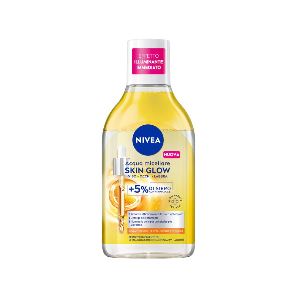 Flacone trasparente con liquido giallognolo. Etichetta con nome prodotto e logo. Etichetta rosa con testo.