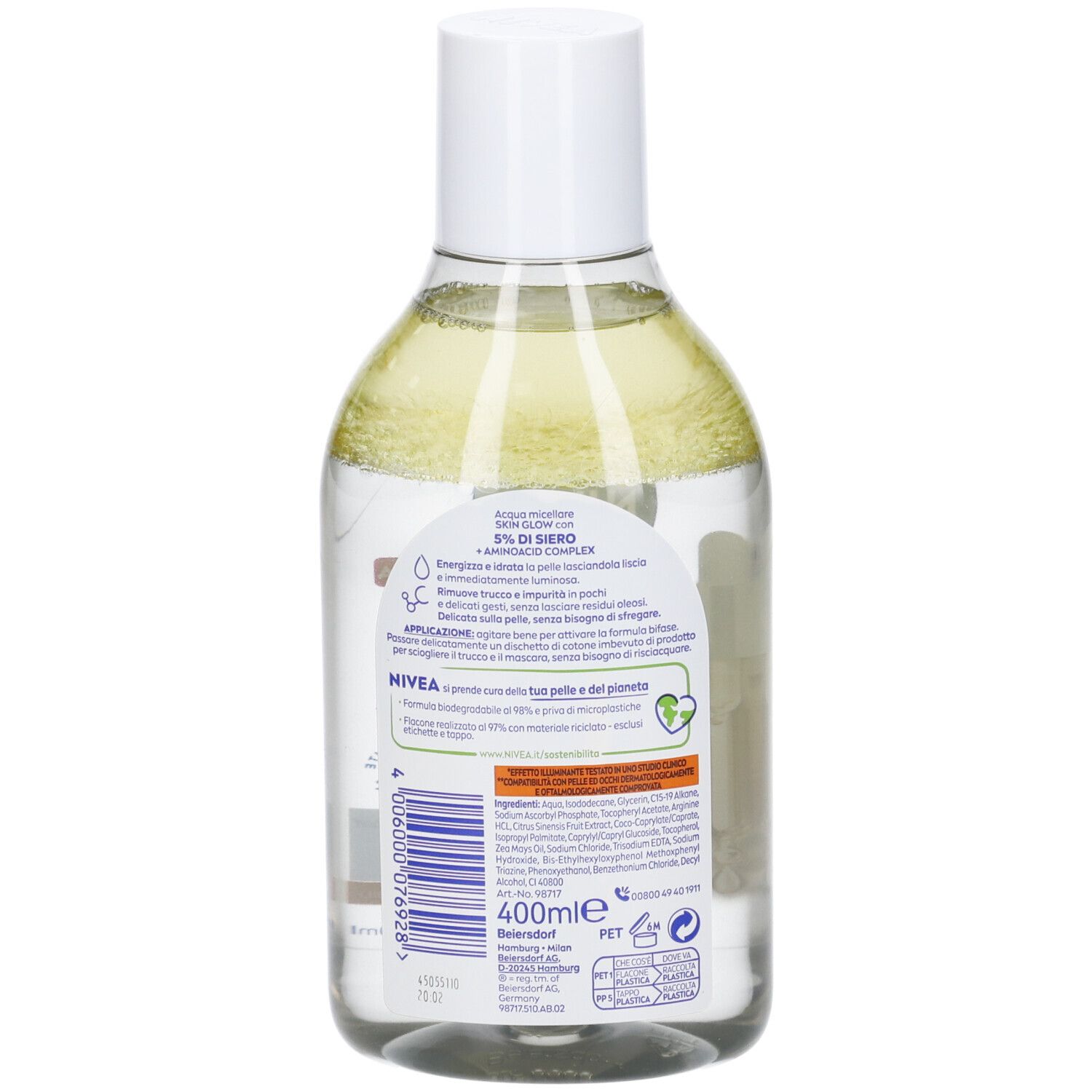 Retro di un flacone trasparente con liquido giallognolo. Etichetta con informazioni e logo.