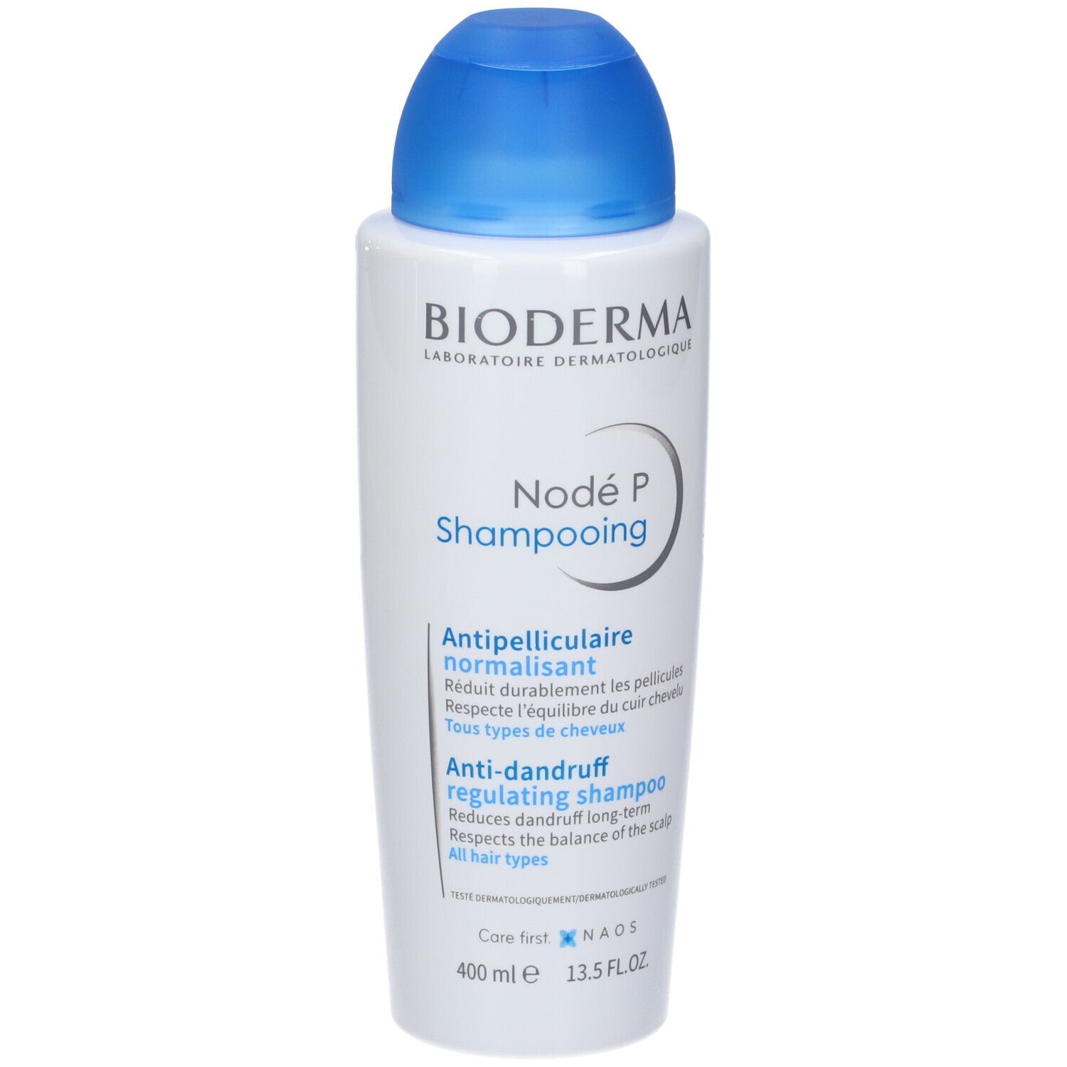 Flacone bianco con tappo blu. Scritta: Bioderma Nodé P Shampooing. Testo: Antiforfora, regolatore.