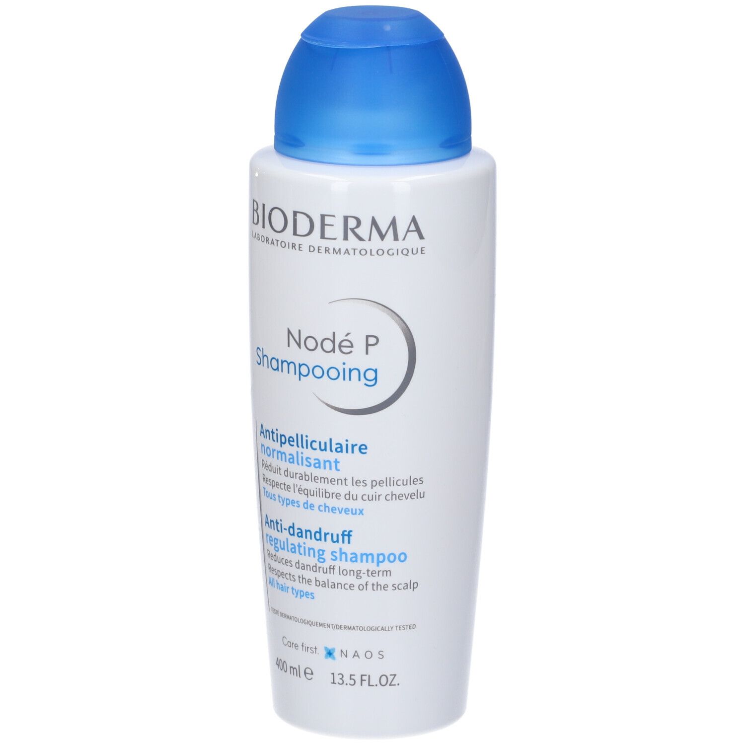 Flacone bianco con tappo blu. Scritta: Bioderma Nodé P Shampooing. Testo: Antiforfora, regolatore.