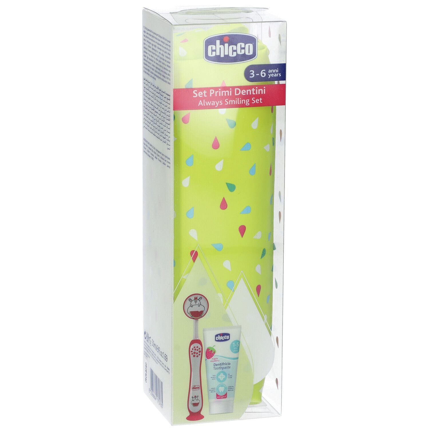 Chicco Set Primi Dentini. Astuccio verde-giallo, spazzolino, dentifricio e specchietto orale in confezione trasparente. Testo sulla confezione.