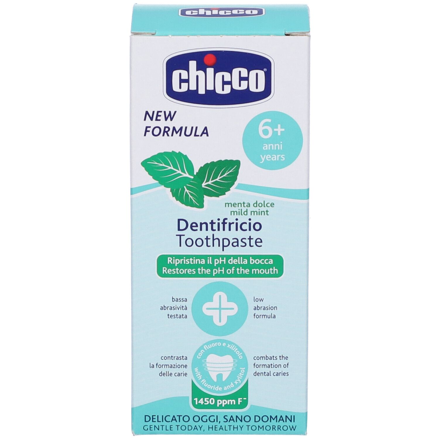 Zahnpasta-Schachtel mit dem Chicco-Logo, Minzblättern und der Aufschrift 'Dentifricio Toothpaste'.