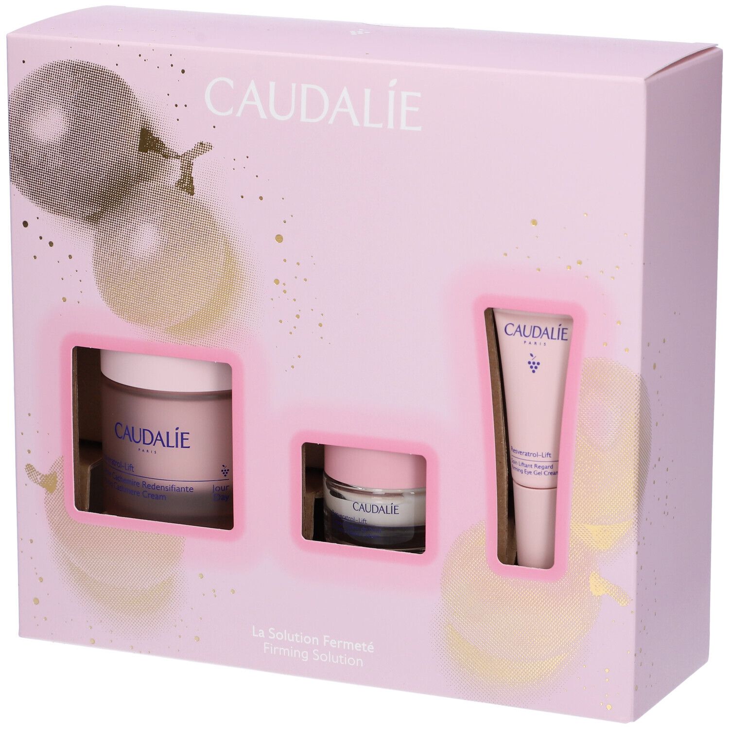 Confezione regalo rosa con tre prodotti Caudalie. Contiene vasetto crema, vasetto piccolo e tubo. Marchio Caudalie visibile.