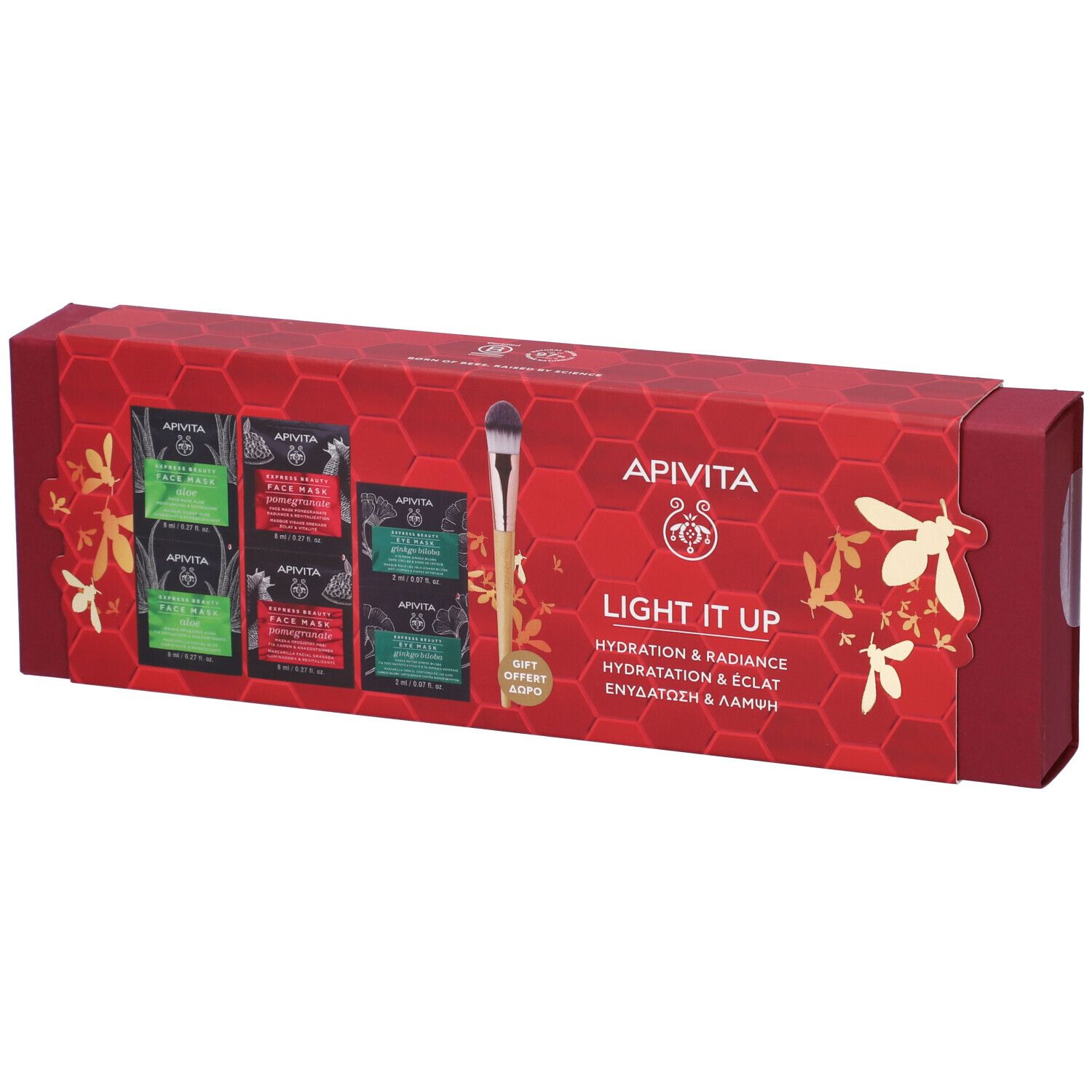 Confezione regalo rossa con maschere viso e pennello applicatore. Scritta: Apivita, Light it up.