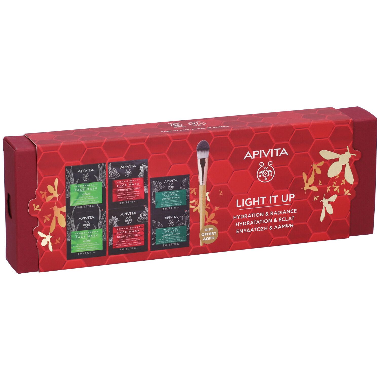 Confezione regalo rossa con maschere viso e pennello applicatore. Scritta: Apivita, Light it up.