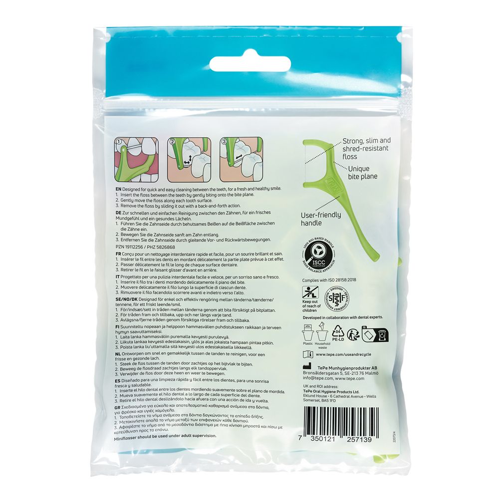 Verpackung mit Zahnseide-Sticks, Gebrauchsanweisung und Qualitätssiegeln.