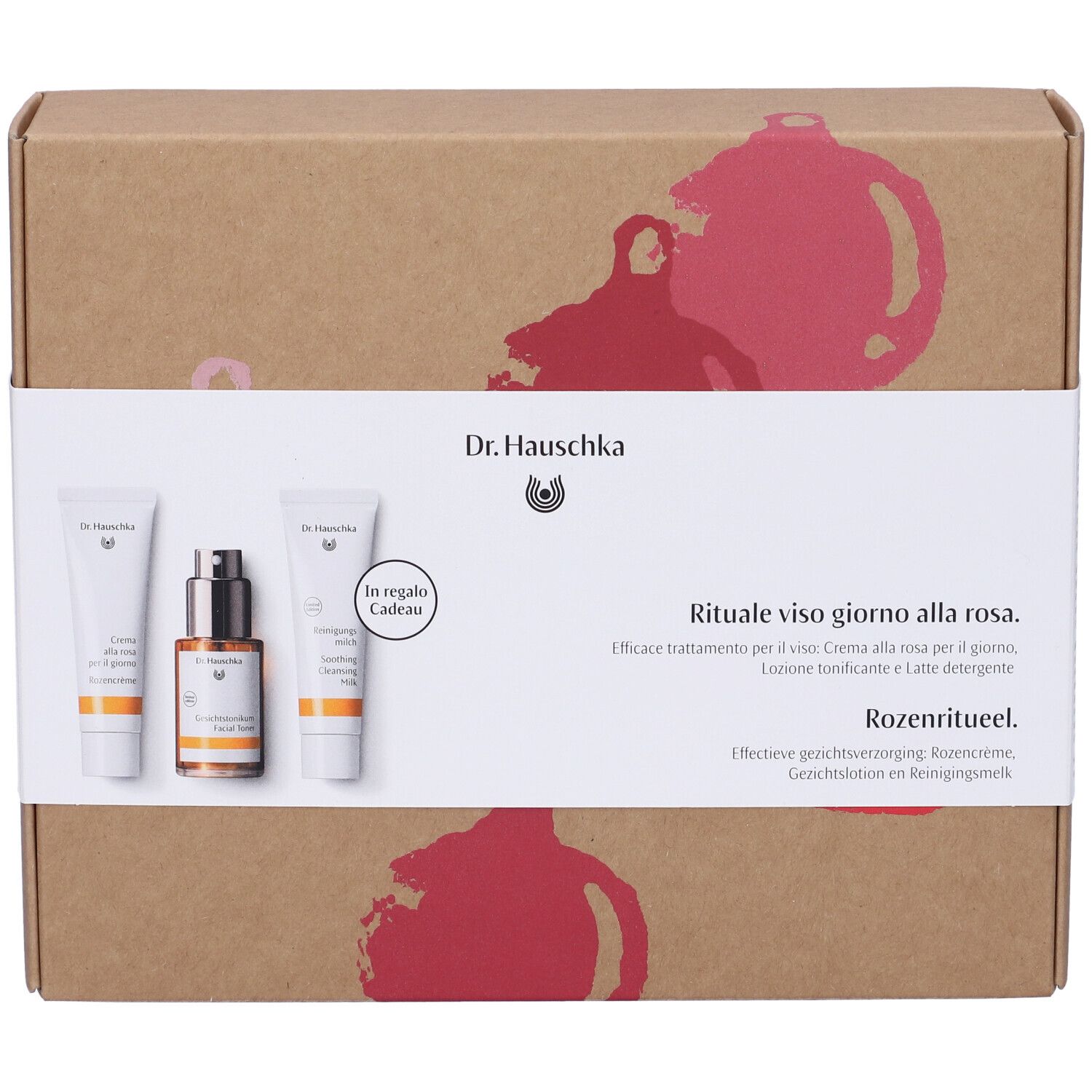 Set regalo con tre prodotti. Scritta: Dr. Hauschka. Rituale alla rosa. Creme e lozioni confezionate in scatola.