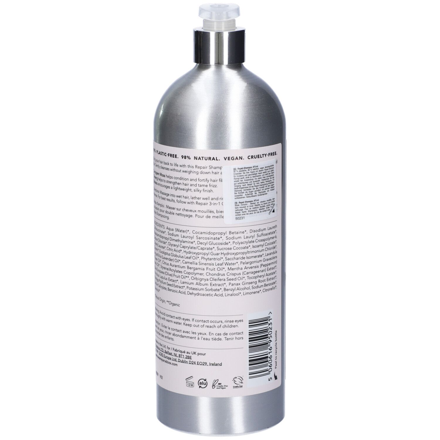 Retro del flacone di shampoo argento. Etichetta rosa con ingredienti, istruzioni e certificazioni. Testo multilingue.