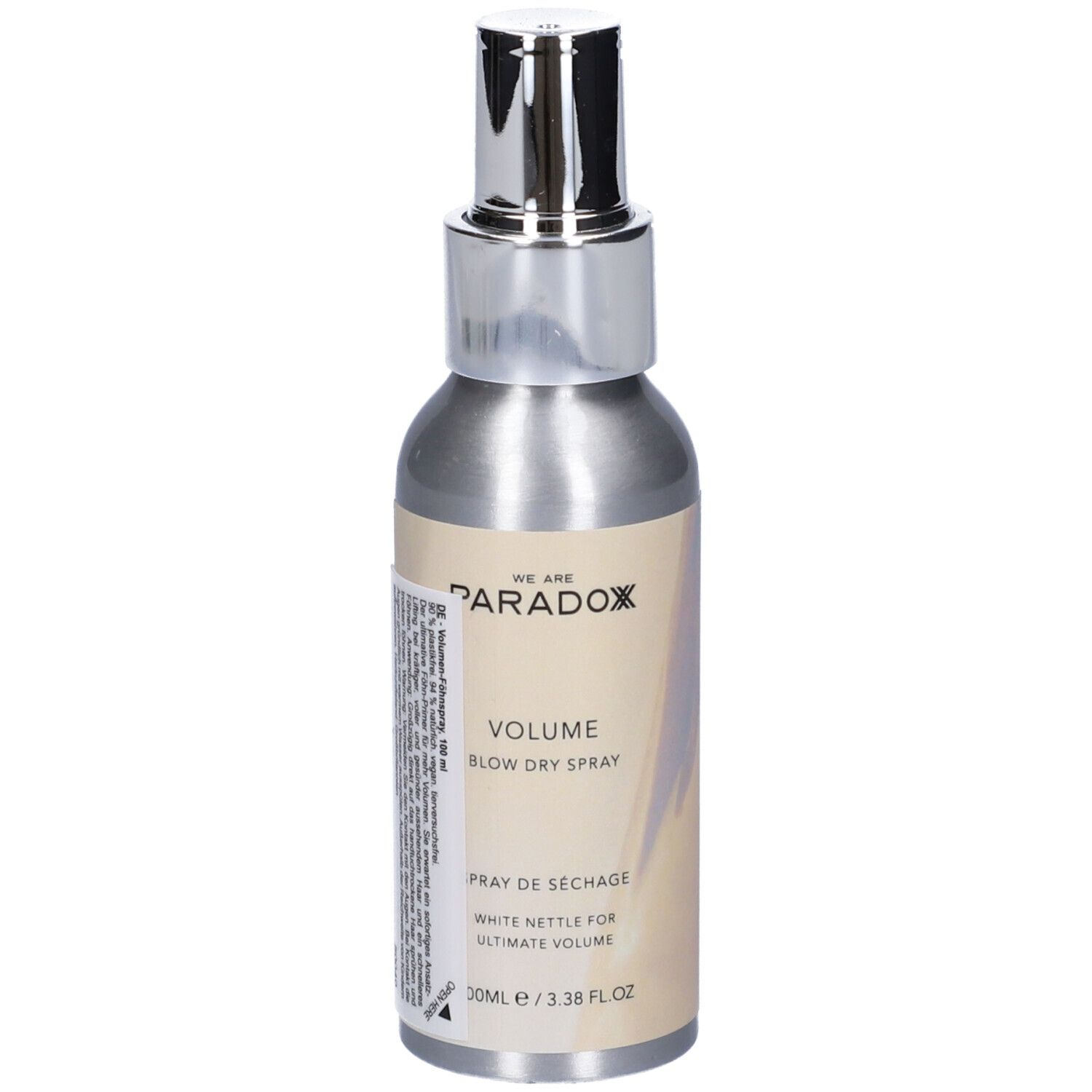 Flacone spray argento con erogatore argento. Scritta: WE ARE PARADOX, VOLUME, BLOW DRY SPRAY, Spray de séchage. 100ml/3.38 FL OZ.