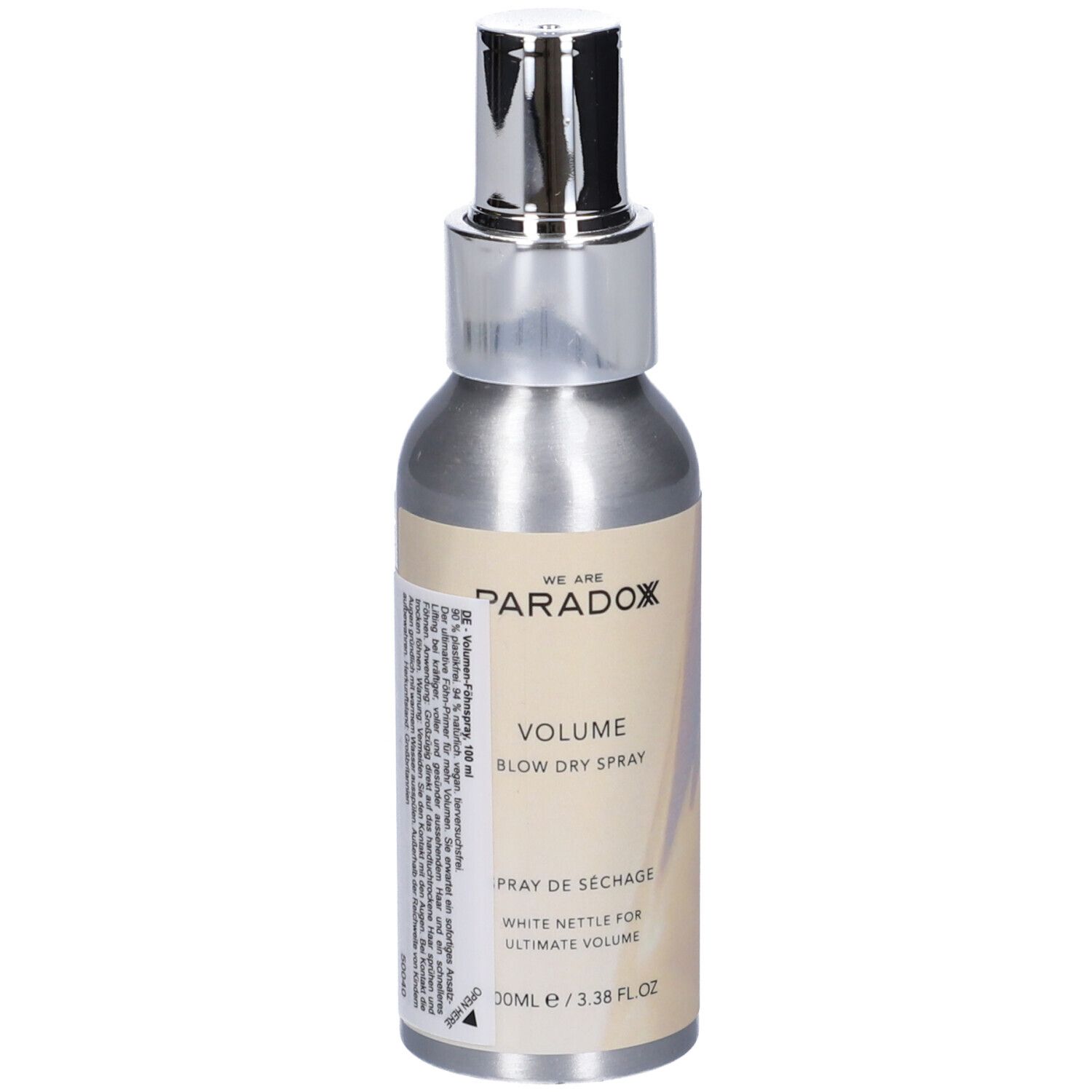 Flacone spray argento con erogatore argento. Scritta: WE ARE PARADOX, VOLUME, BLOW DRY SPRAY, Spray de séchage. 100ml/3.38 FL OZ.