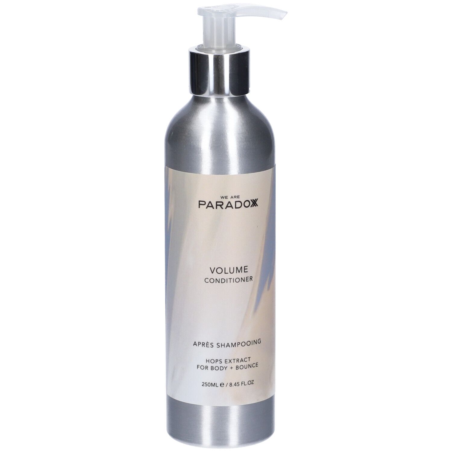 Flacone argento con dosatore. Etichetta con nome prodotto e ingredienti. "We Are Paradox Volume Conditioner".