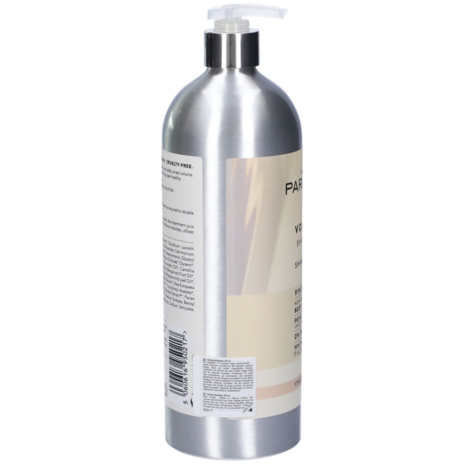 Flacone di shampoo argento con dosatore. Etichetta con ingredienti e informazioni. Cruelty-free e vegano.