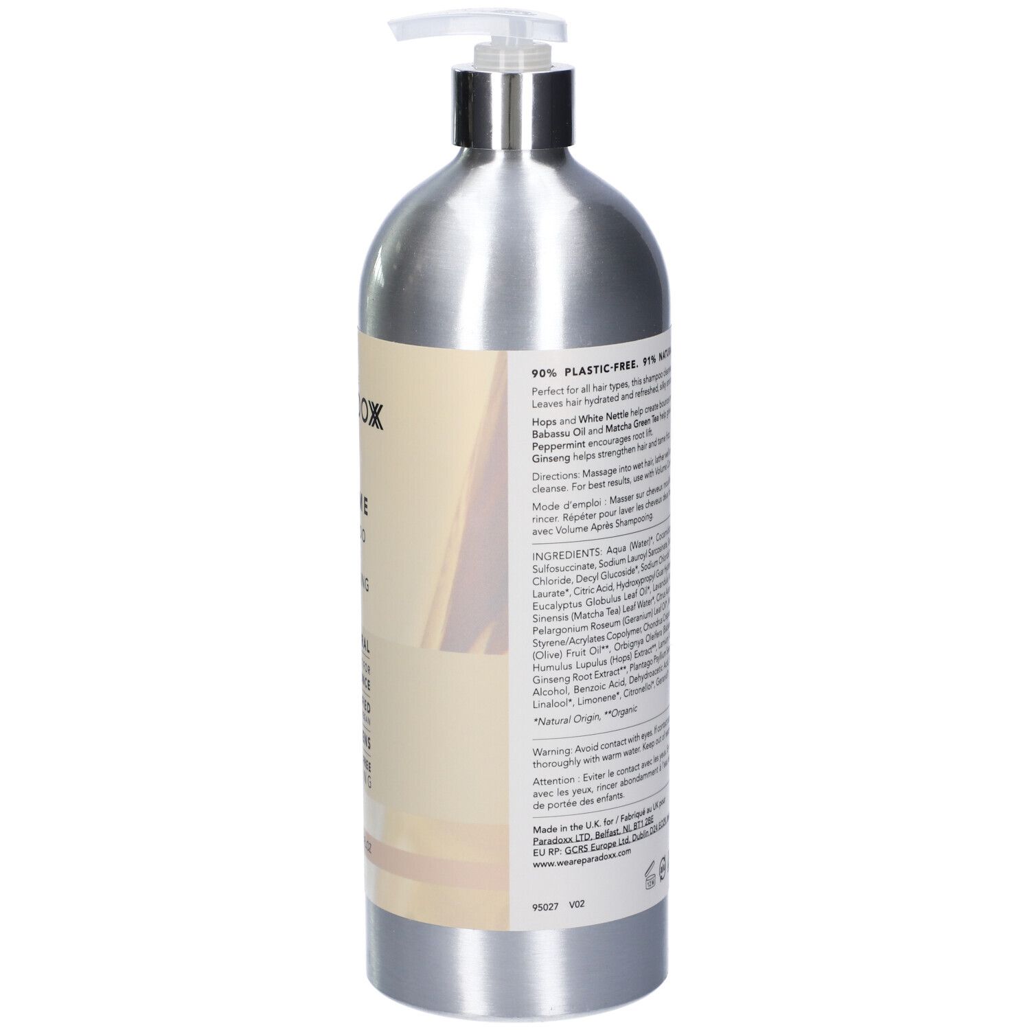 Vista posteriore del flacone di shampoo argento con dosatore. Contiene ingredienti e informazioni. Imballaggio 90% senza plastica.