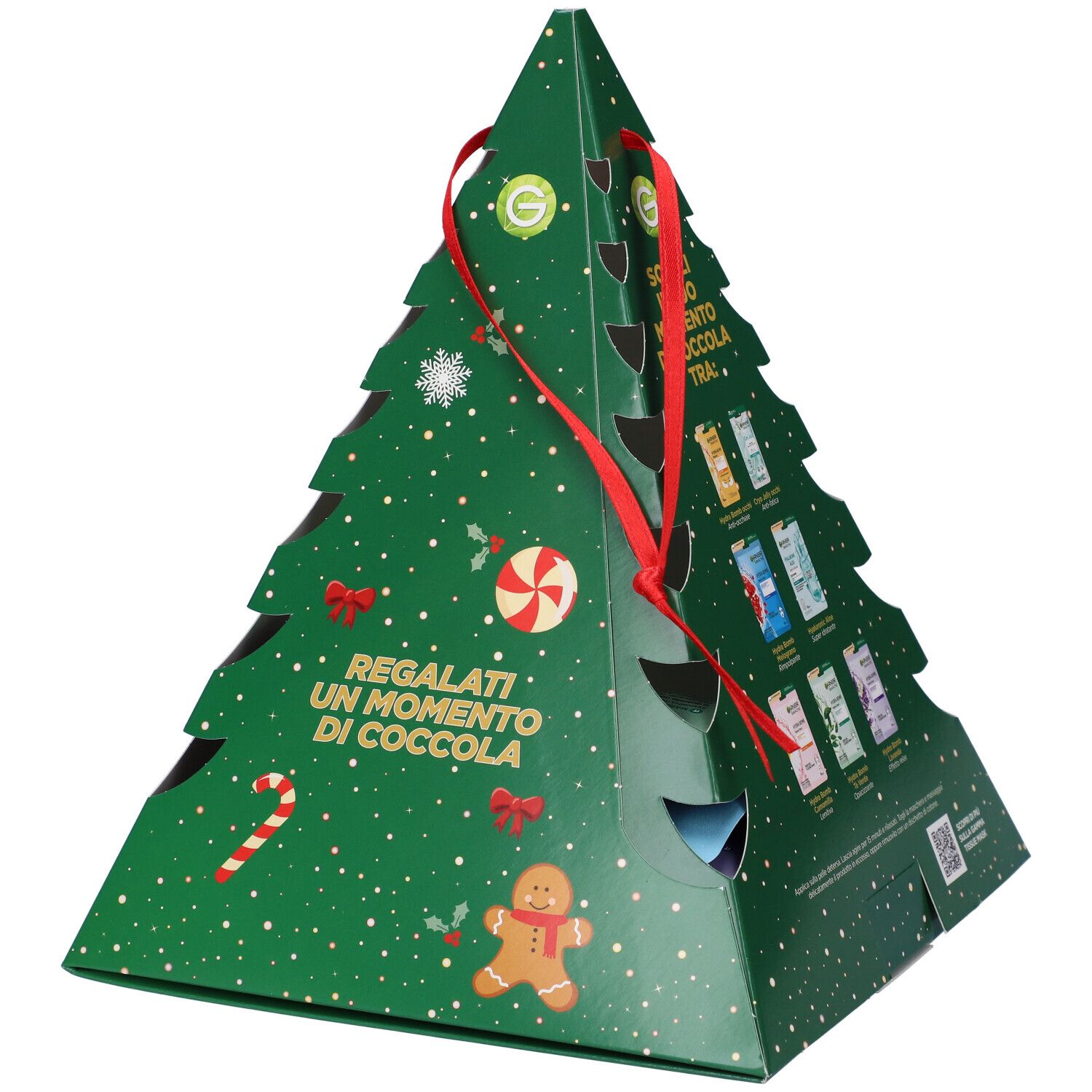 Confezione regalo a forma di albero di Natale verde con maschere Garnier. Mostra diverse maschere. Fiocco rosso. Testo: Scegli il tuo momento di coccola.