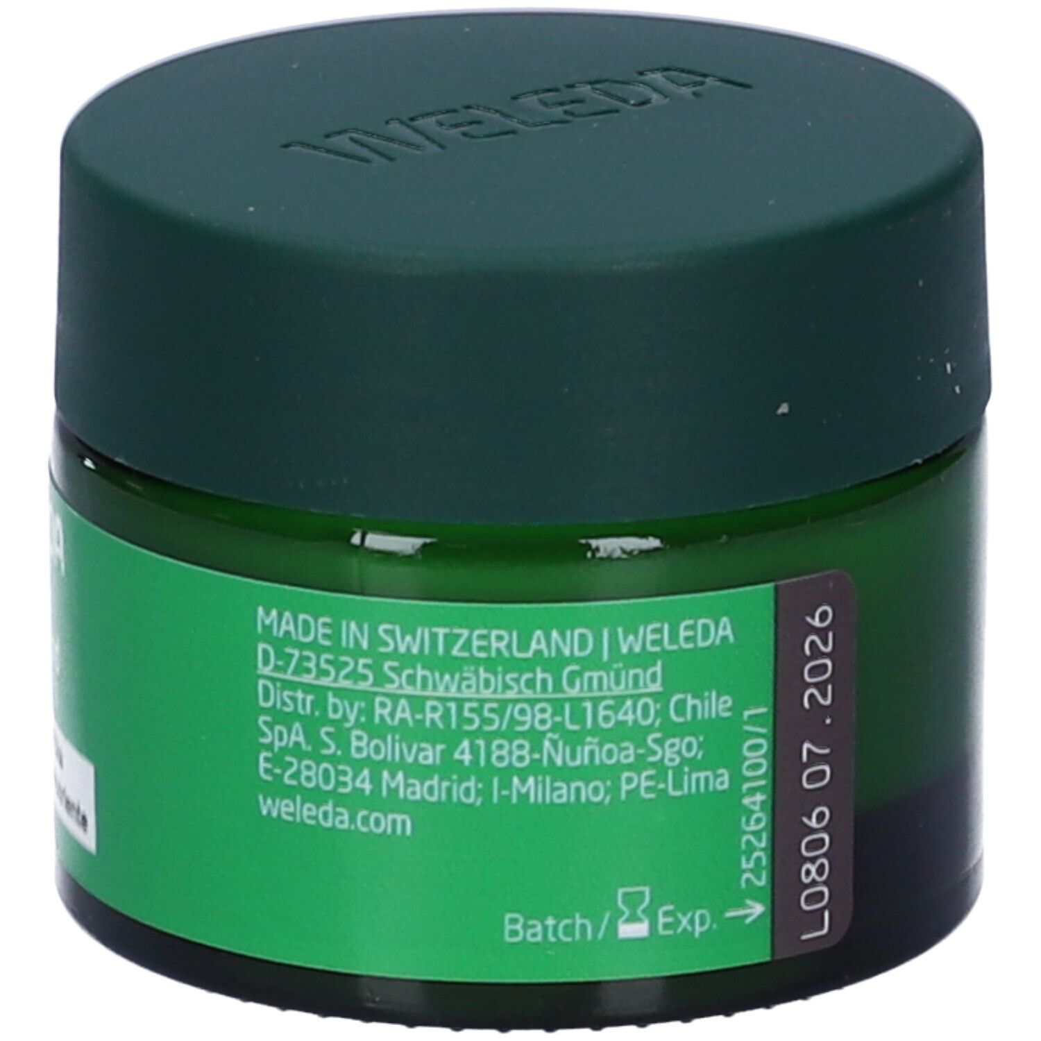 Vasetto verde con coperchio. Scritta: WELEDA. Etichetta con informazioni produttore e data di scadenza.