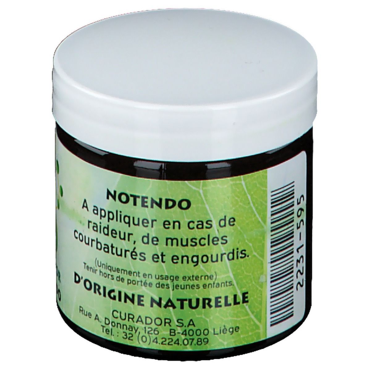 Pot de crème brun foncé avec couvercle blanc. Étiquette verte et blanche avec nom du produit et texte en français.