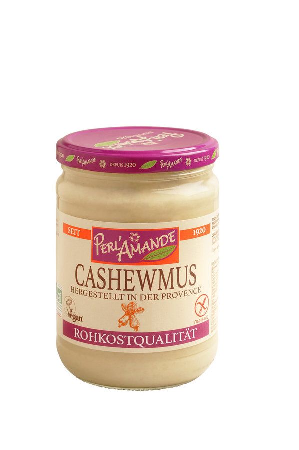 Glas mit Cashewmus. Aufschrift: Perl'Amande, Cashewmus, Rohkostqualität. Vegan-Siegel und glutenfrei-Symbol.