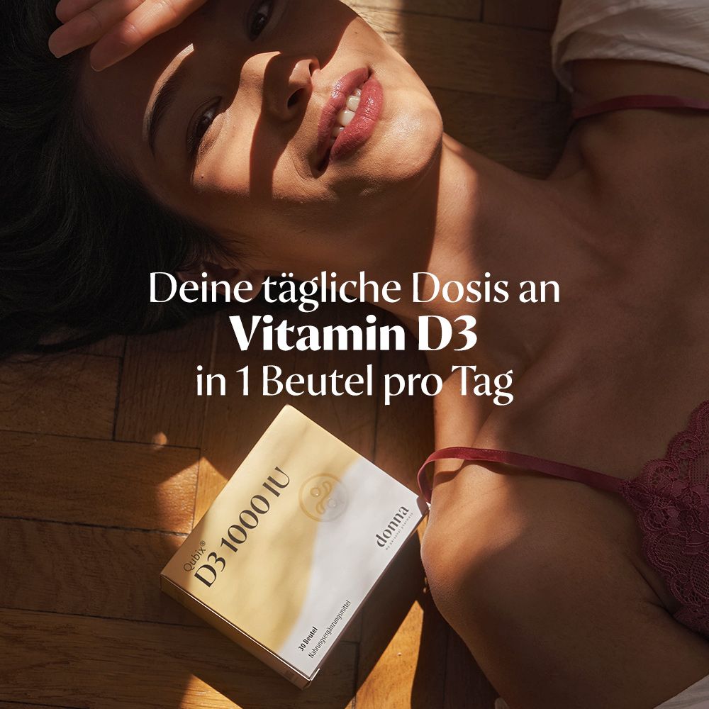 Frau liegt, hält Qubix D3-Packung. Text: Deine tägliche Dosis an Vitamin D3 in 1 Beutel pro Tag, D3 1000 IU, donna.