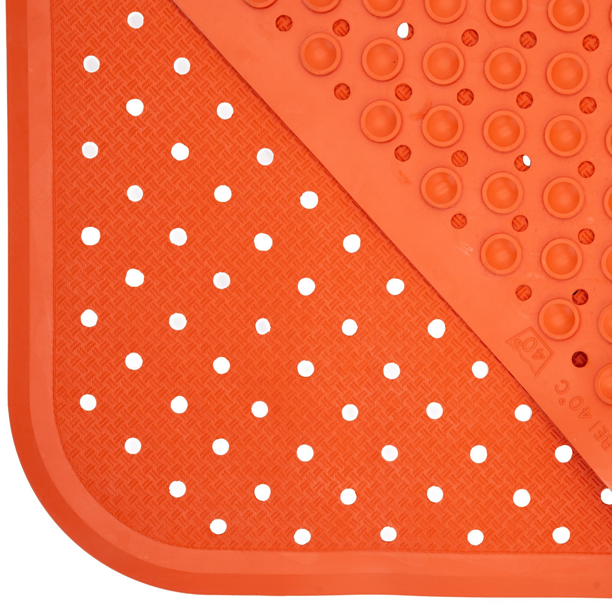 Detailaufnahme einer orangefarbenen Badewanneneinlage mit weißen Punkten. Ecke mit Saugnäpfen.