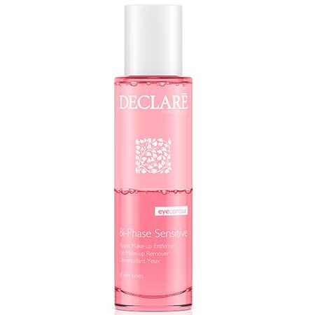 Detergente viso bifasico. Liquido rosa in flacone cilindrico con tappo bianco. Logo DECLARE e nome del prodotto visibili.