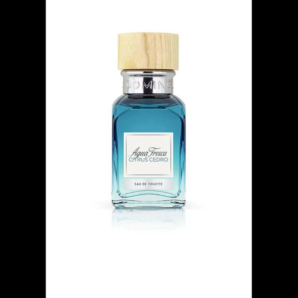 Flakon mit blauem Inhalt und Holzdeckel. Aufschrift: Agua Fresca Citrus Cedro. Eau de Toilette.