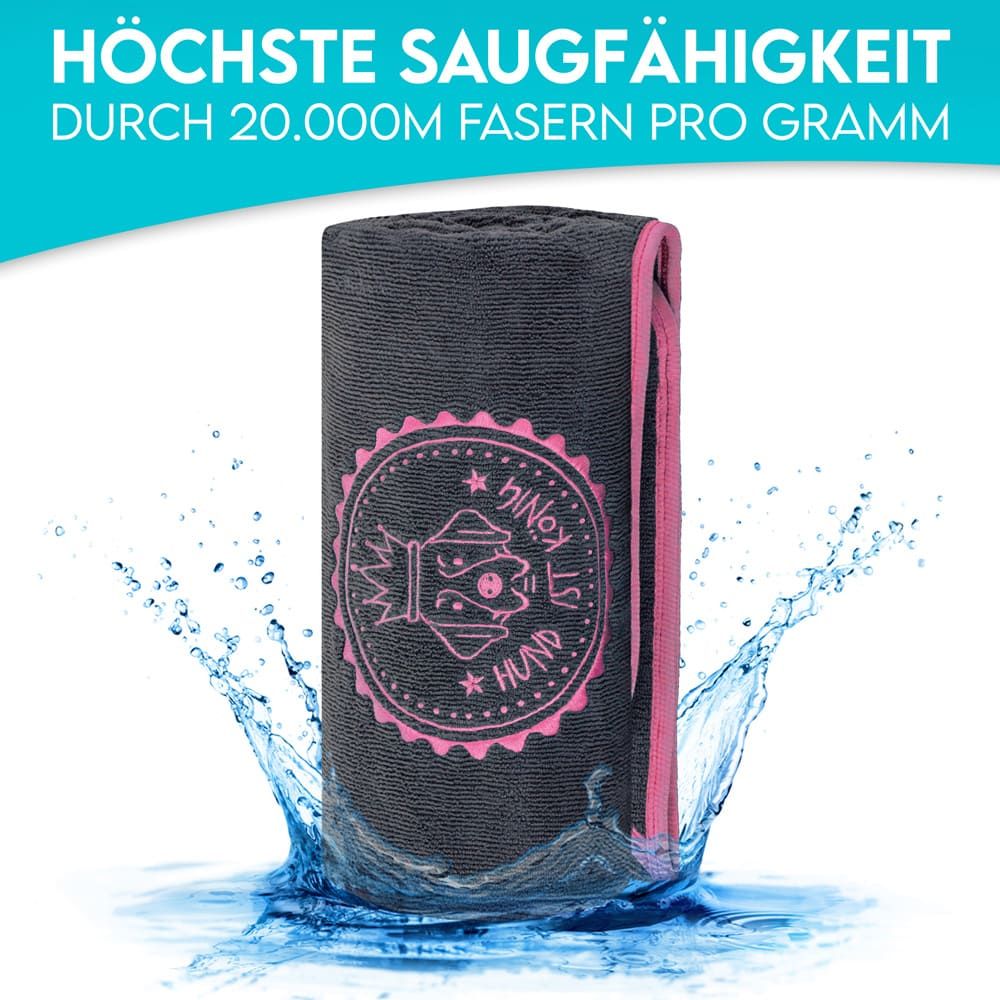 Graues Hundehandtuch in Wasser. Rosa Logo mit Krone und Schriftzug. Text: Höchste Saugfähigkeit.