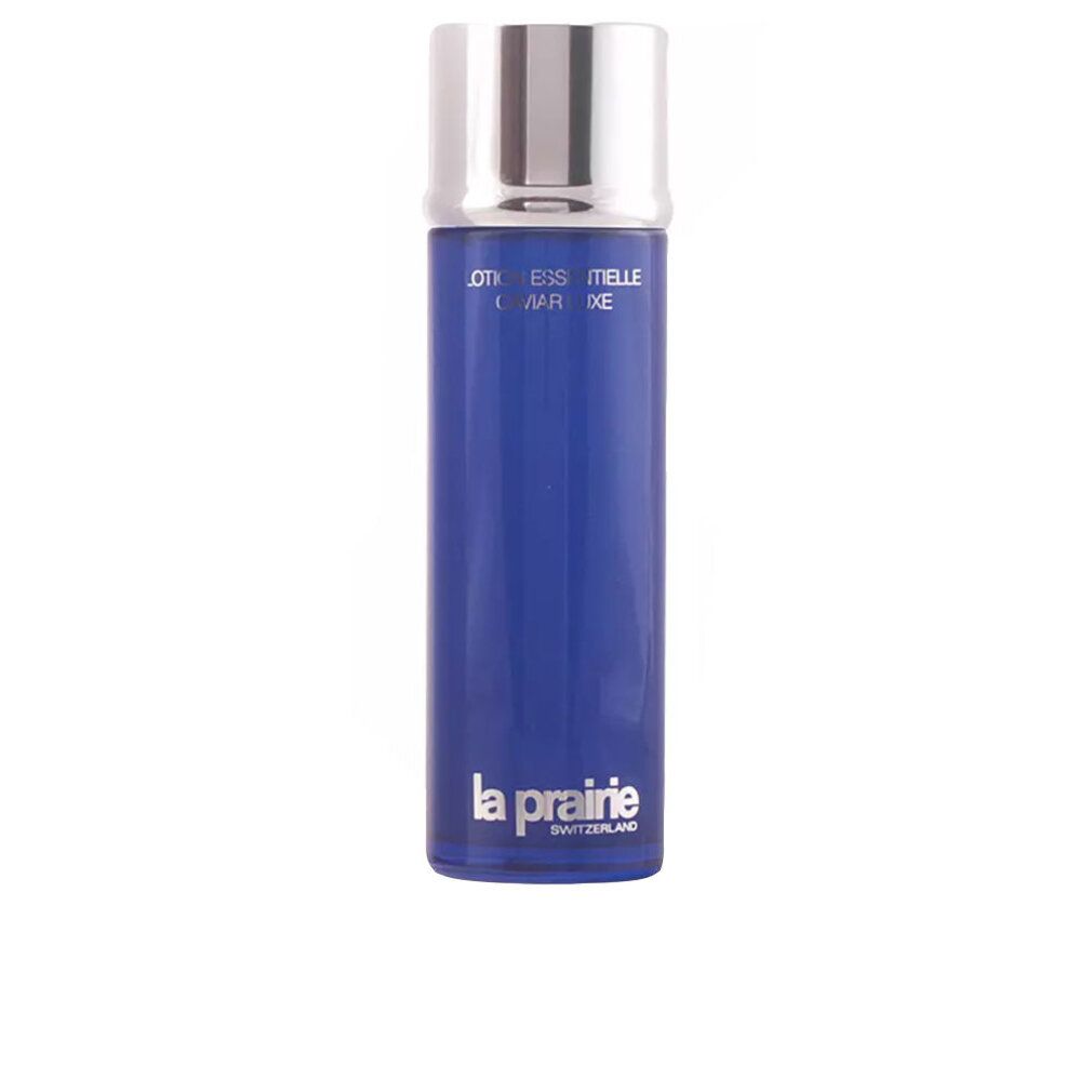 Blaue Flasche mit silbernem Deckel. Aufschrift: Essence-in-Lotion. Marke: La Prairie.