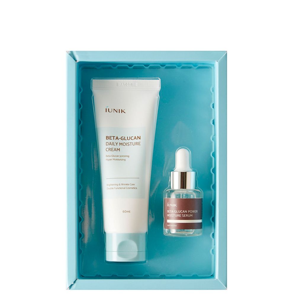 iUNIK Beta-Glucan Edition Pflegeset: Feuchtigkeitscreme-Tube und Serum-Fläschchen in einer blauen Schale.