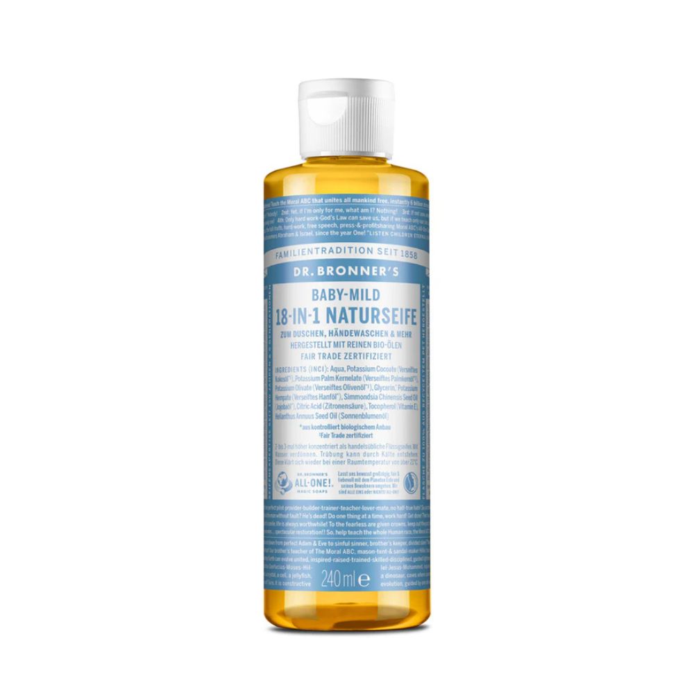 Flüssigseife von Dr. Bronner's. Baby-Mild, 18-in-1 Naturseife. Weiße Kappe, transparente Flasche mit gelber Flüssigkeit. Blaue Etikett mit Text.