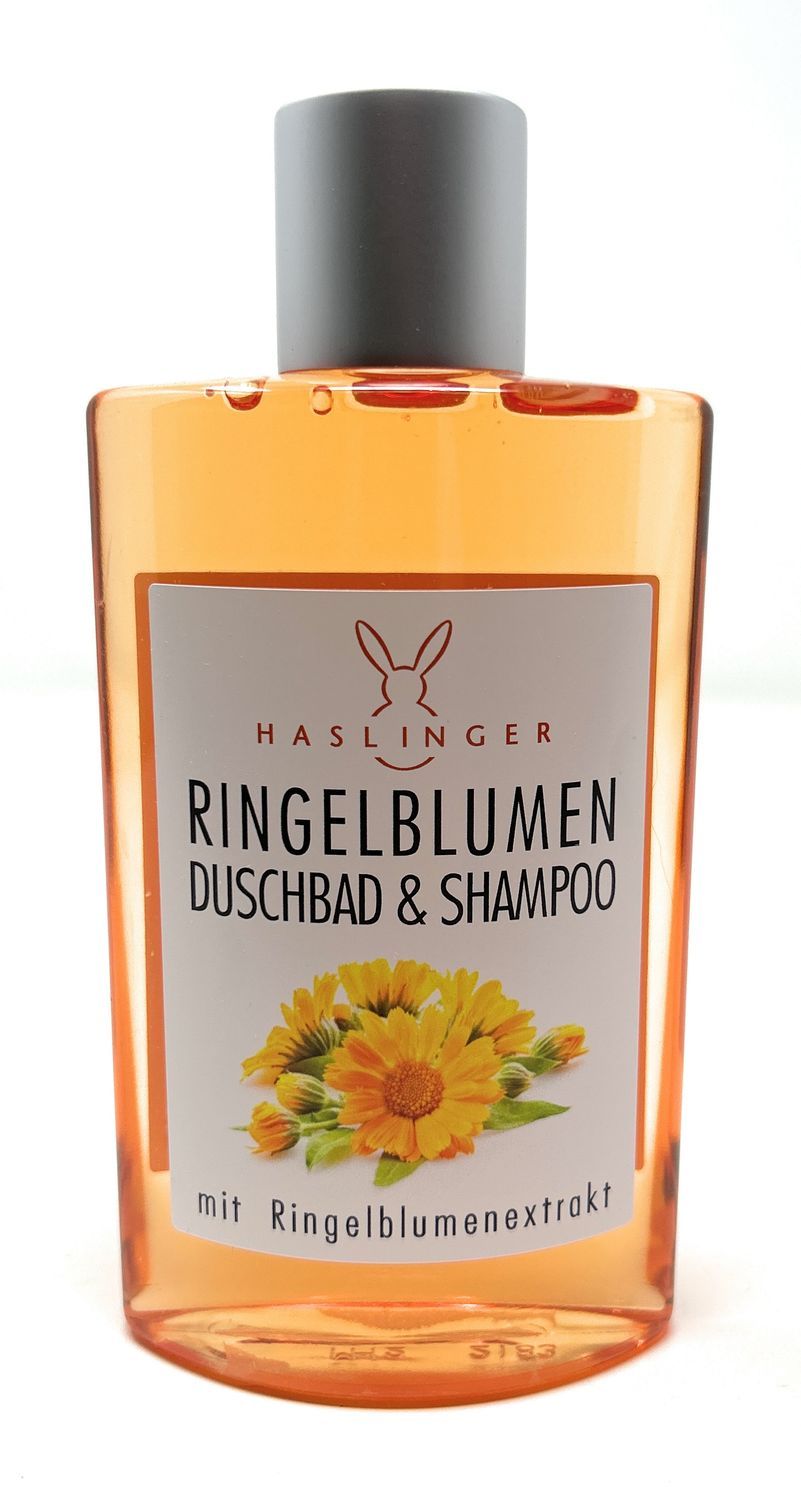 Flasche mit orangefarbenem Duschbad & Shampoo. Aufkleber mit Ringelblumen-Illustration und Text. Grauer Deckel.