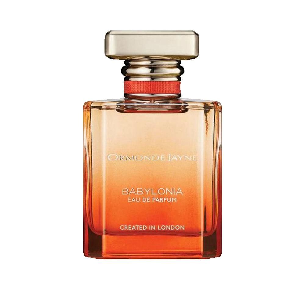 Quadratischer Flakon mit goldfarbenem Verschluss. Aufschrift: BABYLONIA EAU DE PARFUM. Hergestellt in London. Farbverlauf von Orange nach Gelb.