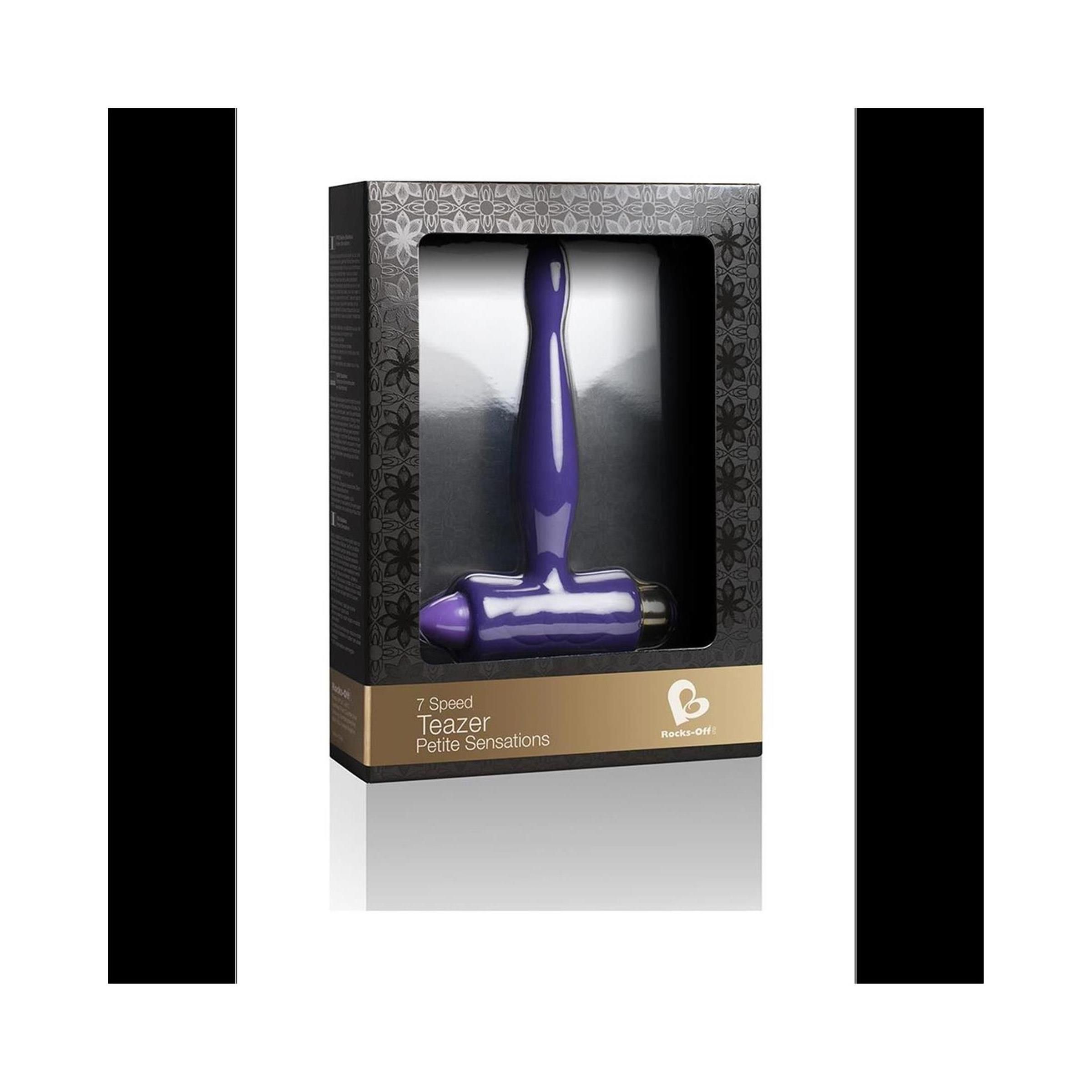 Lila Analspielzeug in schwarzer Verpackung mit Sichtfenster. Goldfarbener Schriftzug "Teazer".