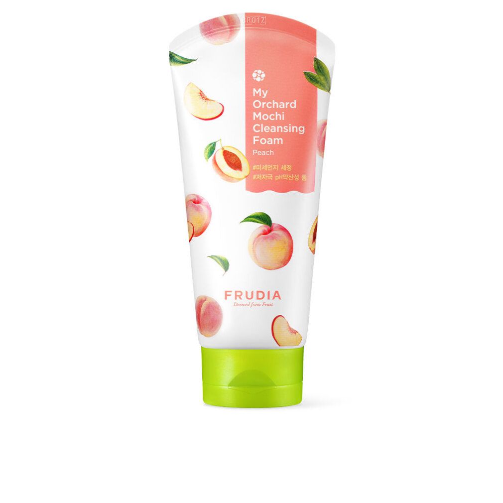 Weiß-rosa Tube mit Pfirsich-Illustrationen. Text: My Orchard Mochi Cleansing Foam, Frudia. Grüner Deckel.
