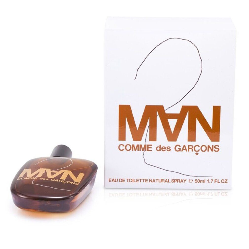 CDG 2 MAN Eau de Toilette Spray. Flakon und Verpackung. Braune Flüssigkeit, schwarzer Verschluss. Weißer Karton.