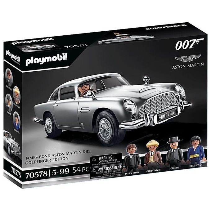 Set di gioco Playmobil 70578, James Bond Aston Martin DB5 Goldfinger Edition. Il set mostra un'auto giocattolo argentata con personaggi di James Bond, Goldfinger e altri. La confezione mostra il logo Playmobil, il nome del prodotto e l'età consigliata 5-99 anni.