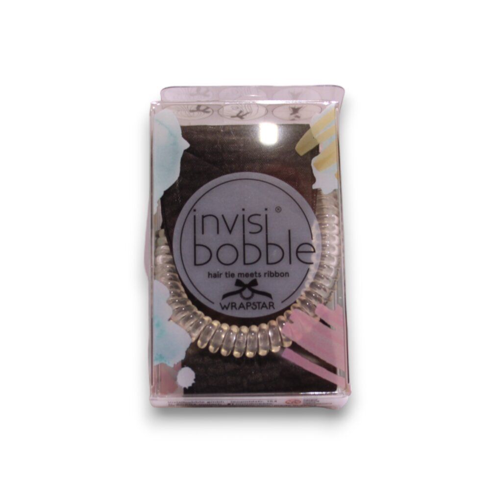 Haargummi in transparenter Verpackung. Sichtbar ist ein spiralförmiges Haargummi. Auf der Verpackung ist der Markenname "invisibobble" zu sehen.