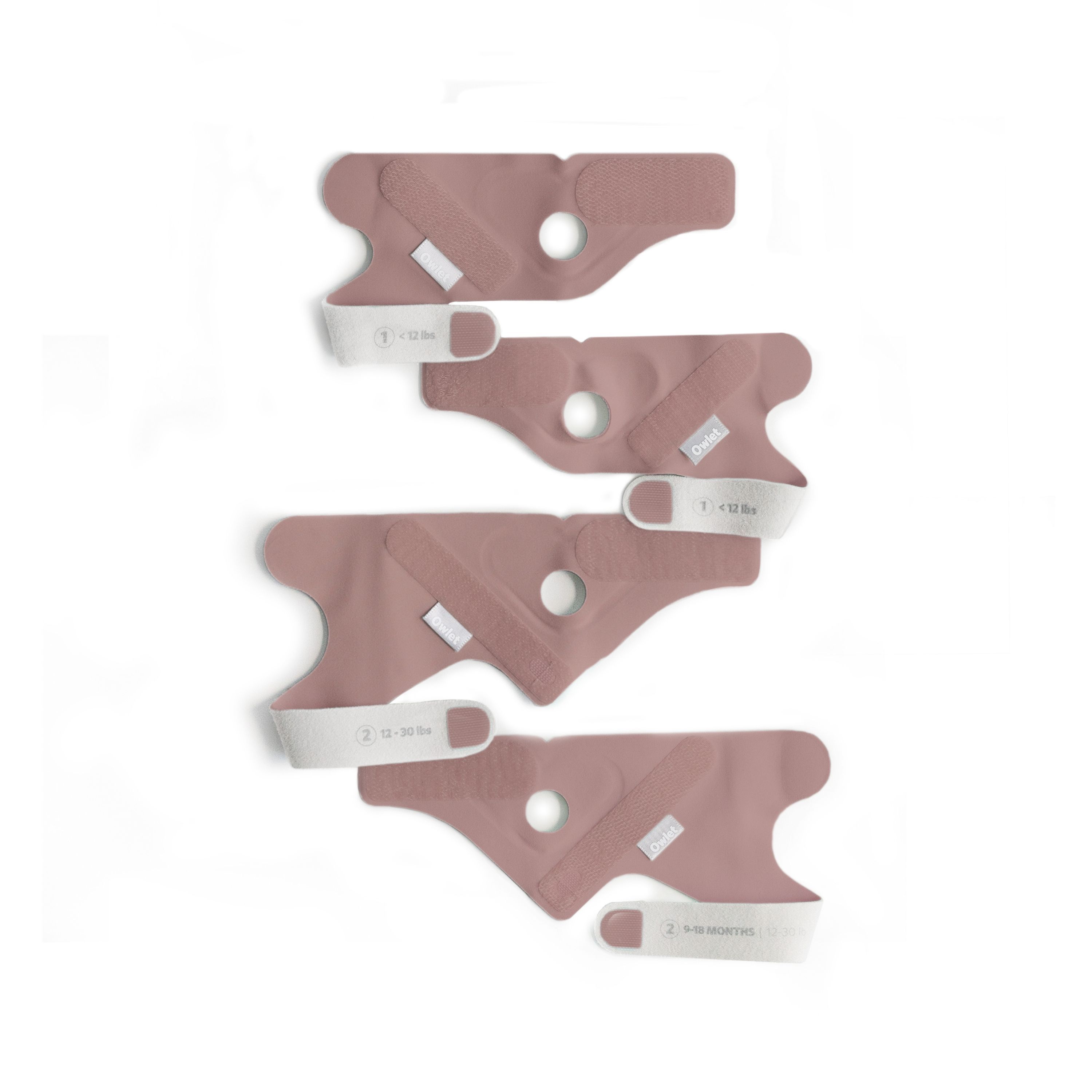Vier Owlet Dream Sock® Socken in verschiedenen Größen mit Sensoren.