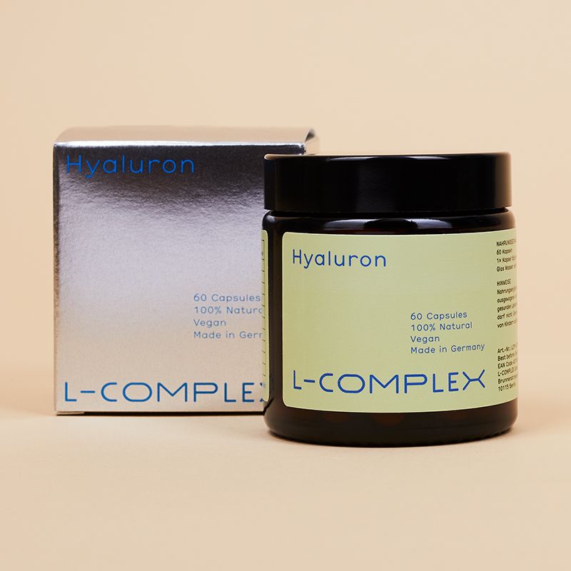 Braune Glasdose und silberne Schachtel. Aufschrift: Hyaluron, 60 Kapseln, L-COMPLEX. Schachtel mit Produktnamen.