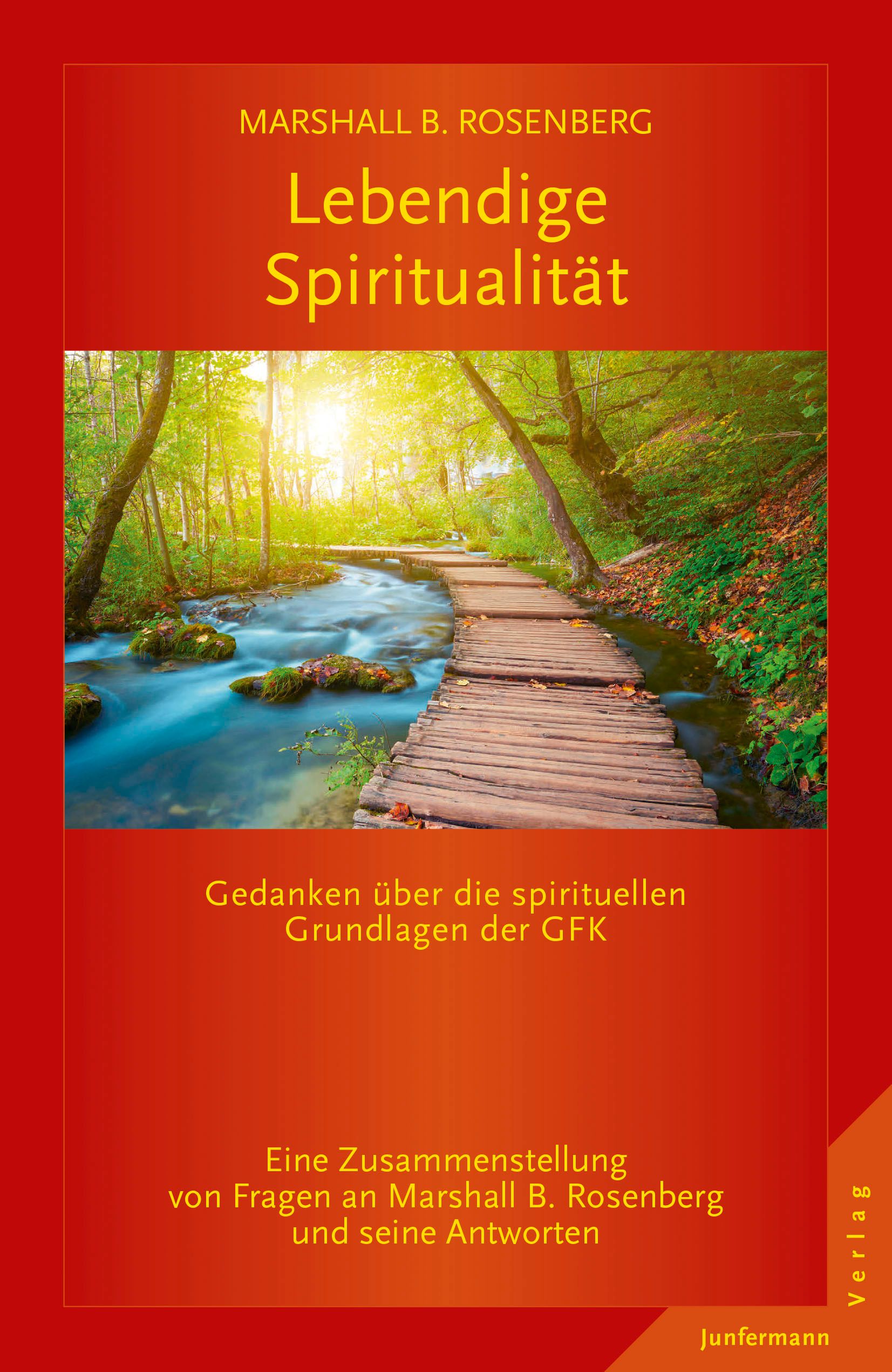 Buchcover: Lebendige Spiritualität. Titel in gelb auf rotem Hintergrund. Landschaftsbild mit Holzsteg und Fluss.