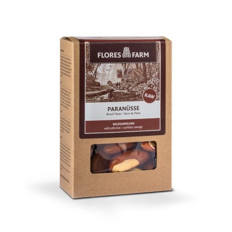 Kartonverpackung mit Paranüssen. Sichtfenster zeigt Nüsse. Aufschrift: Flores Farm, Paranüsse, RAW.